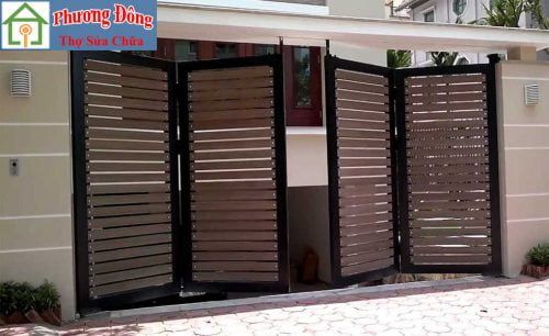 Thợ đang Sơn sửa cửa sắt quận tân phú