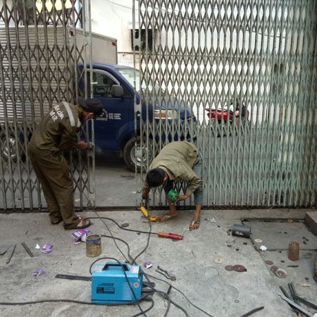 sửa cửa kéo xếp sắt