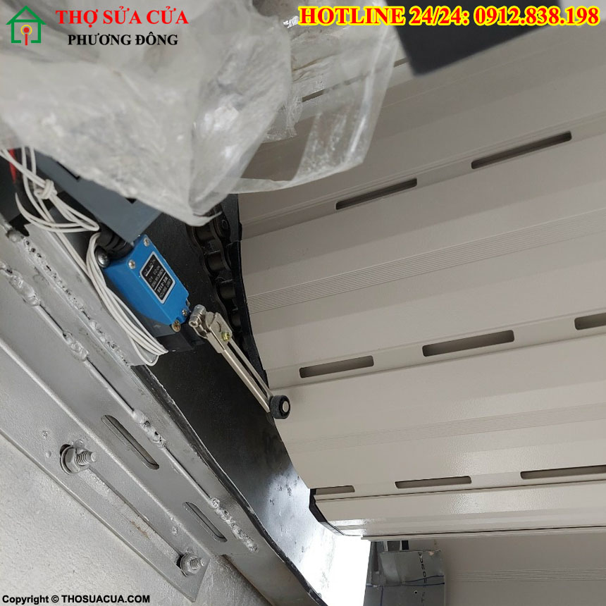 thay mô tơ cửa cuốn